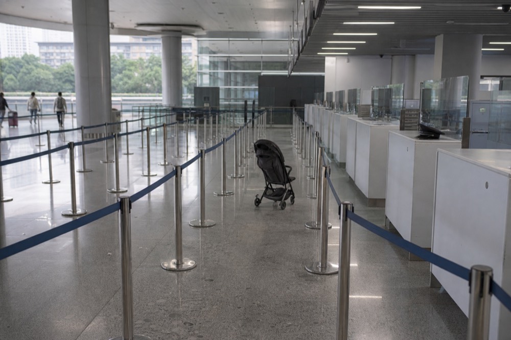 Passport control counters with queue barriers in an airport hall
