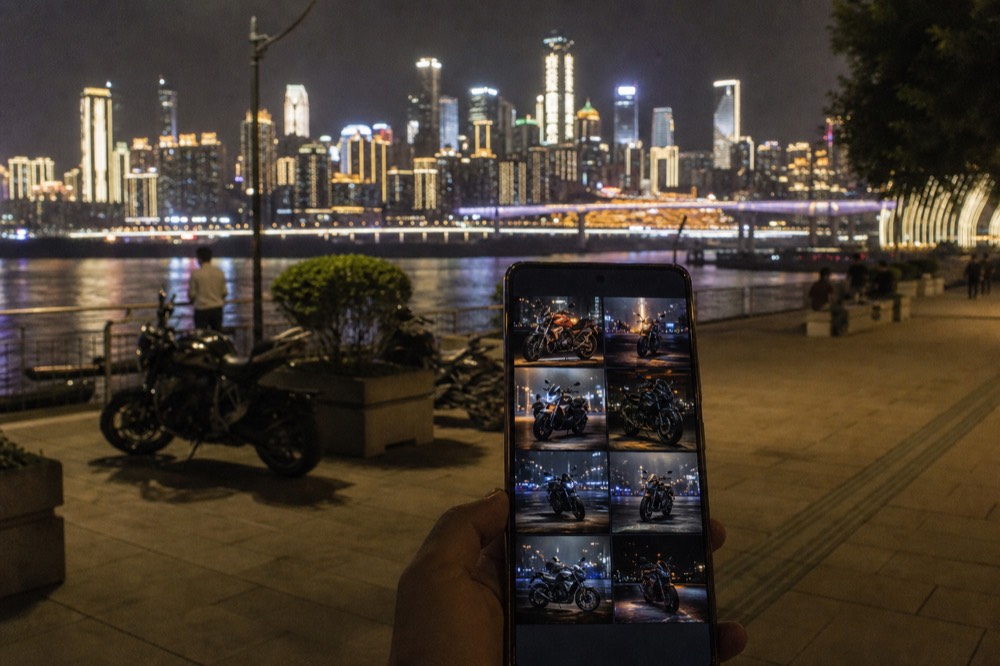 A smartphone screen displaying a gallery of retouched motorcycle shoot photos delivered after the session